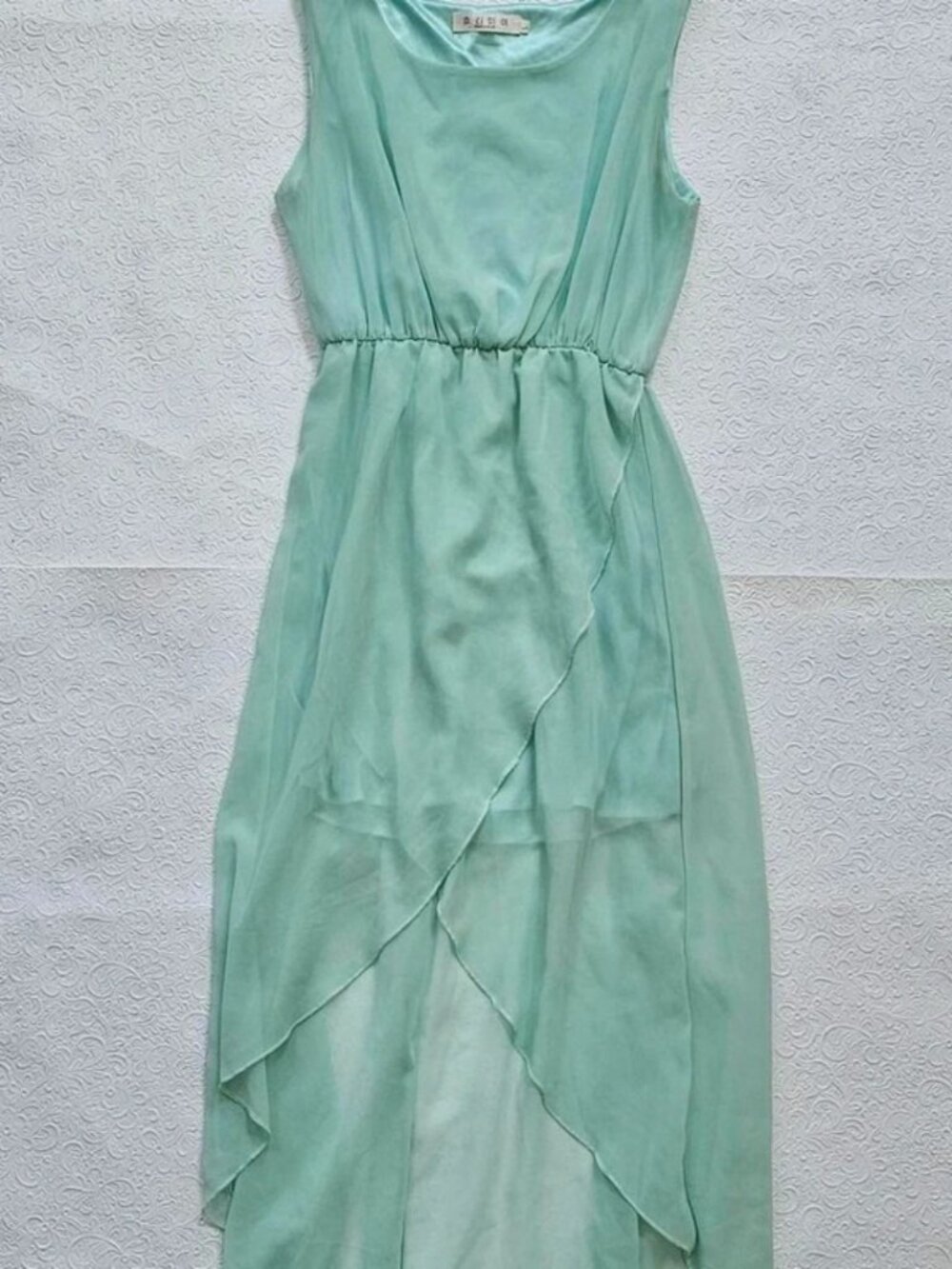 Hermay mint green midi dress with asymmetrical hem and flowy fabric